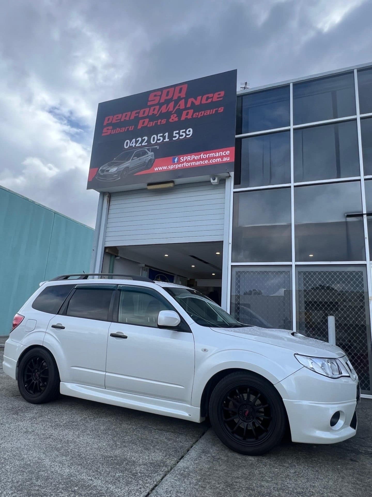 The SPR Performance workshop frontage at 1/46 Olympic Circuit, Southport, with a Subaru Forester parked outside